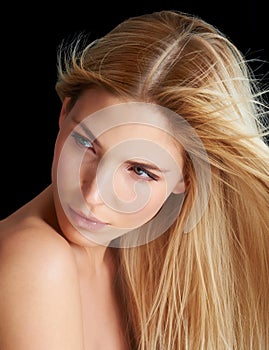 Wind, hair care and skincare of woman, beauty and thinking isolated on a black studio background. Hairstyle, makeup and