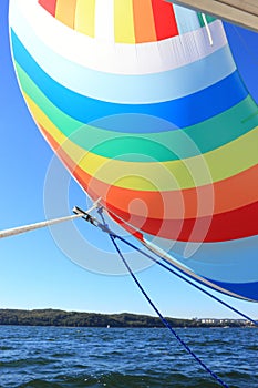 The wind has filled colorful spinnaker sail