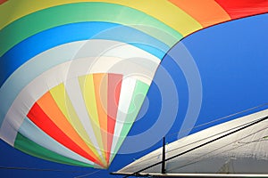 The wind has filled colorful spinnaker sail