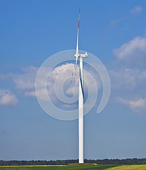 Wind mill against blue sky