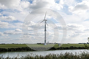 Wind mill against sky for energy power production