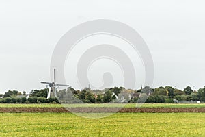 Wind mill in Dutch landscape