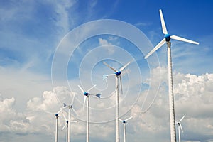 Wind mill power plant against blue sky