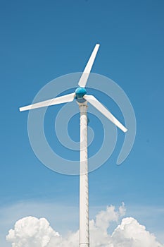 Wind mill power plant against blue sky
