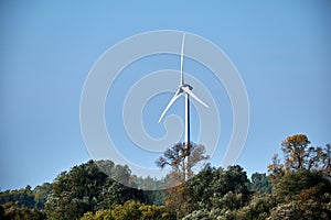 Wind mill turbine with blue sky landscape