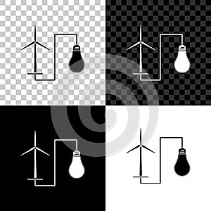 Wind mill turbine generating power energy and glowing light bulb icon on black, white and transparent background