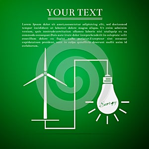 Wind mill turbine generating power energy and glowing light bulb. Natural renewable energy production using wind mills