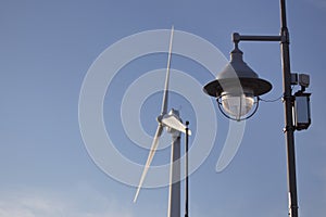 Wind mill turbine over the blue sky