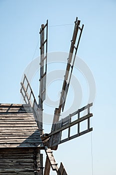 Wind mill. Windmill in a rural area. Wind Farm. Dutch windmill. Landscape with traditional Ukrainian windmills houses in