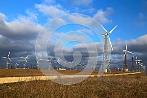 Wind mills during bright summer day