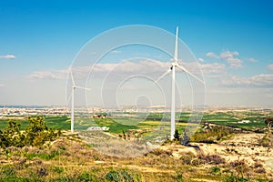 Wind mills during bright summer day