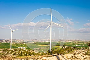 Wind mills during bright summer day