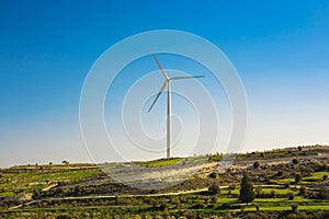 Wind mills during bright summer day