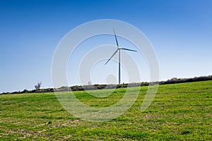 Wind mills during bright summer day