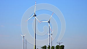 Wind mills during bright summer day