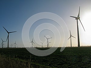 Wind Mills / turbines in a Wind Park in East Frisia, producing sustainable green energy for a clean future