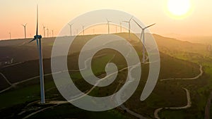 Wind power energy turbine industry farm aerial sunset