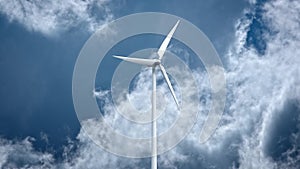 Wind power generators on sky background.