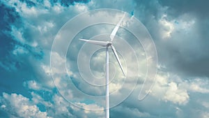 Wind power generators on sky background.