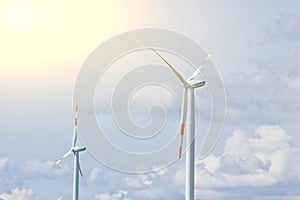 Wind power plant on the background of bright cloudy sky. wind generator close-up. green electricity, alternative energy