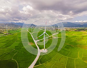 Wind power plant. green meadow with Wind turbines generating electricity