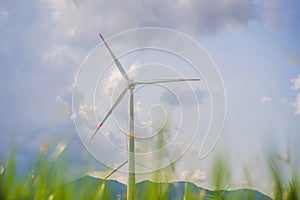 Wind power plant. green meadow with Wind turbines generating electricity