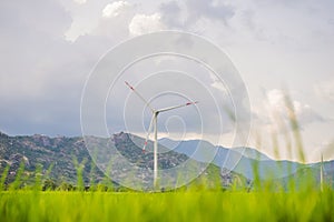 Wind power plant. green meadow with Wind turbines generating electricity