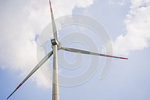 Wind power plant. green meadow with Wind turbines generating electricity