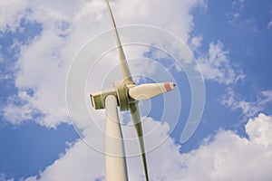 Wind power plant. green meadow with Wind turbines generating electricity