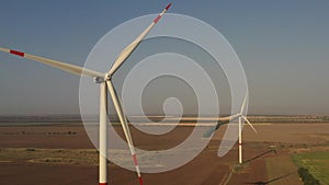 Wind power station on evening sky background