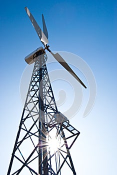 Wind power station - wind turbine against the blue