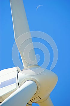 Wind power - turbine, blue sky and moon
