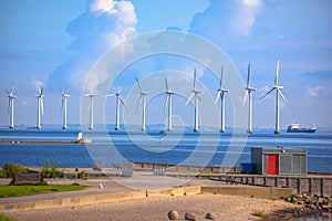 Wind power turbines in Oresund channel between Sweden and Denmark view photo