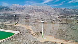 Wind power turbines under Velebit mountain view