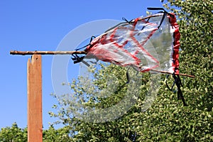 Wind-powered bird scarer in the garden. Bird scare device which helps to get rid of nuisance birds.