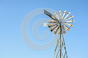 Wind pump against blue sky