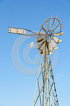 Wind pump against blue sky