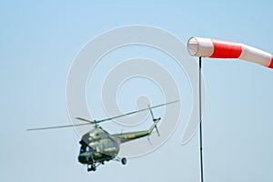 Wind sleeve flying on a blue sky