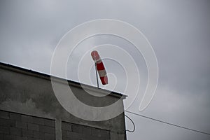 Wind sleeve indicator on the roof during windy day