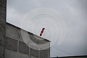 Wind sleeve indicator on the roof during windy day