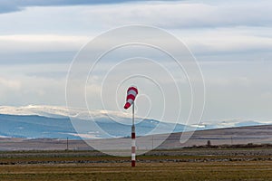Wind sock on agricultural field at wintertime