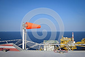 The wind sock is set on the oil rig to showing wind direction