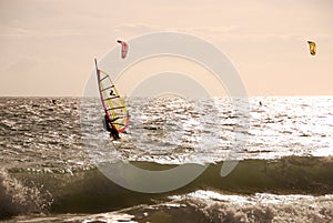 Wind surf and Kite surf at cloudy day in Portugal