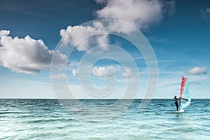 Wind surfer on a calm ocean at the North Sea