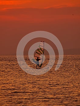 Wind surfer at sunset