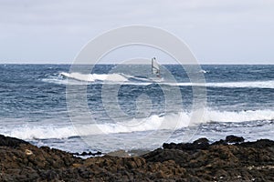 Wind surfing on the island\'s coast in the area of Jameos