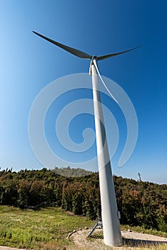 Wind turbine above the hill - Renewable energy