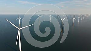 Wind turbine from aerial view, Drone view at windfarm Westermeerdijk a windmill farm in the lake IJsselmeer the biggest