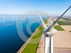 Wind turbine from aerial view, Drone view at windpark westermeerdijk a windmill farm in the lake IJsselmeer the biggest