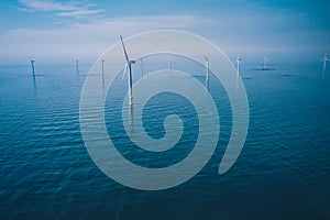 Wind turbine. Aerial view of wind turbines or windmills farm field in blue sea in Finland